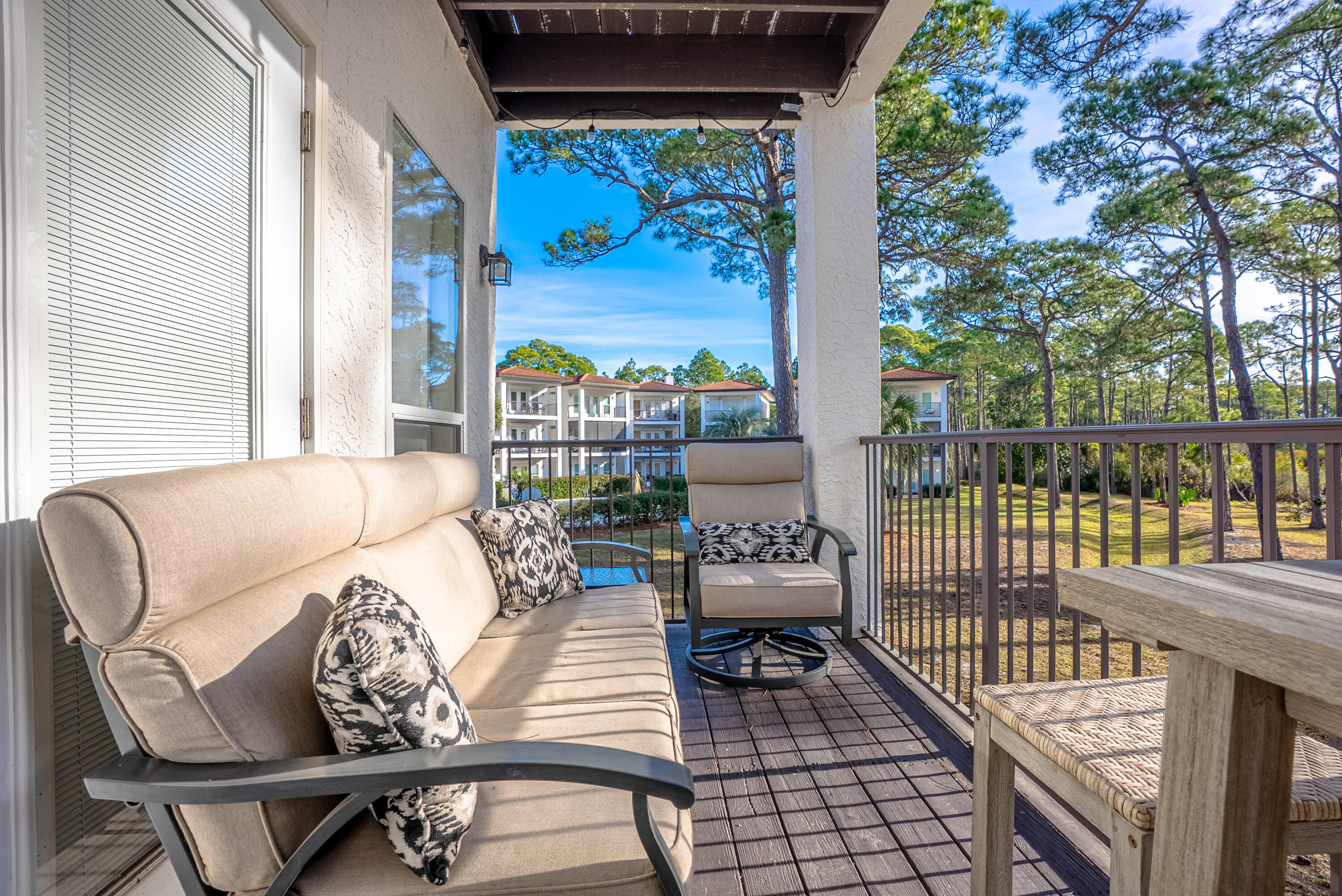 10 Mar-A-Lago Boulevard, Unit 14 Santa Rosa Beach, FL 32459 - Photo 36 of 47 a living room with furniture and a floor to ceiling window