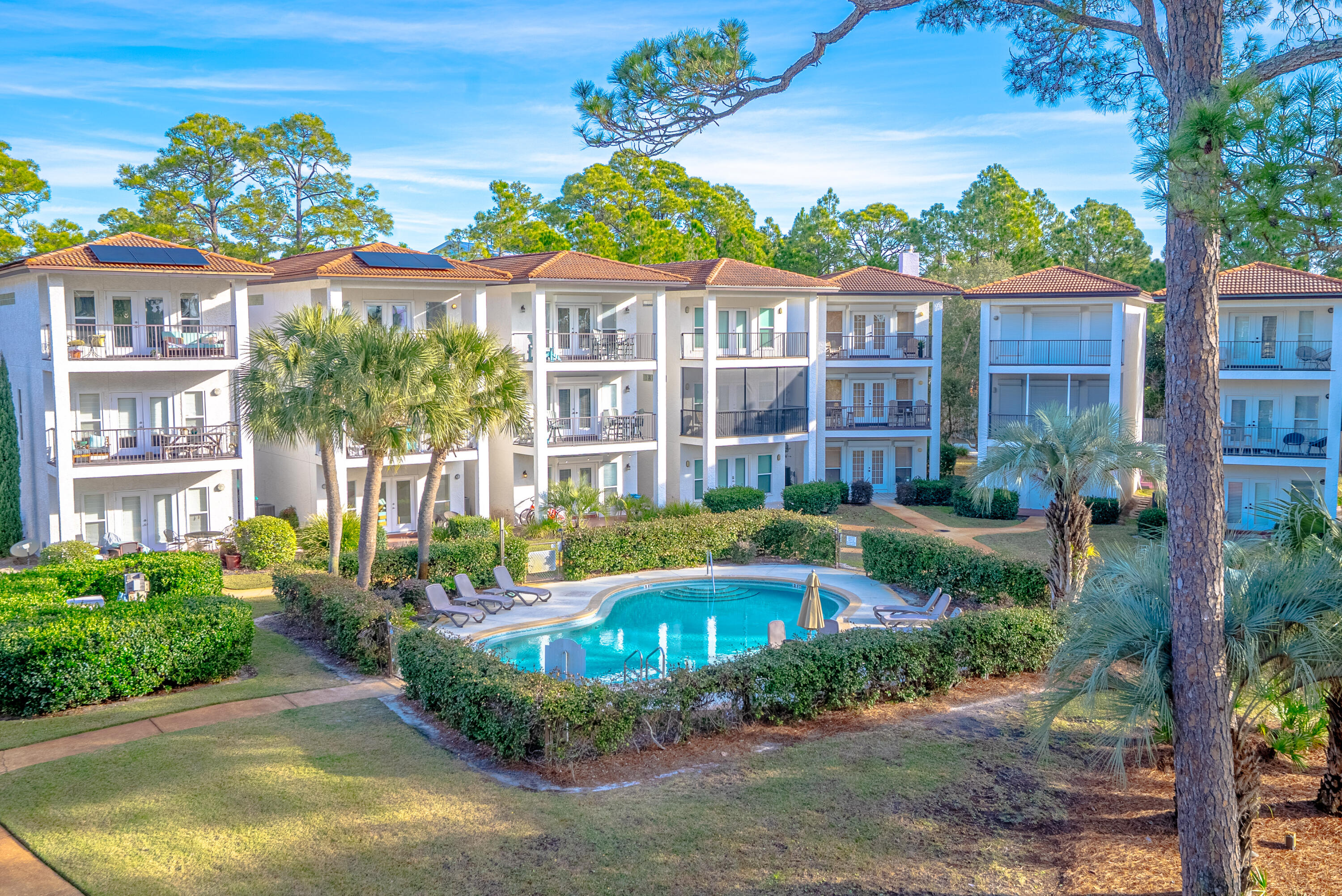 10 Mar-A-Lago Boulevard, Unit 14 Santa Rosa Beach, FL 32459 - Photo 42 of 47 a front view of a building with a garden and plants