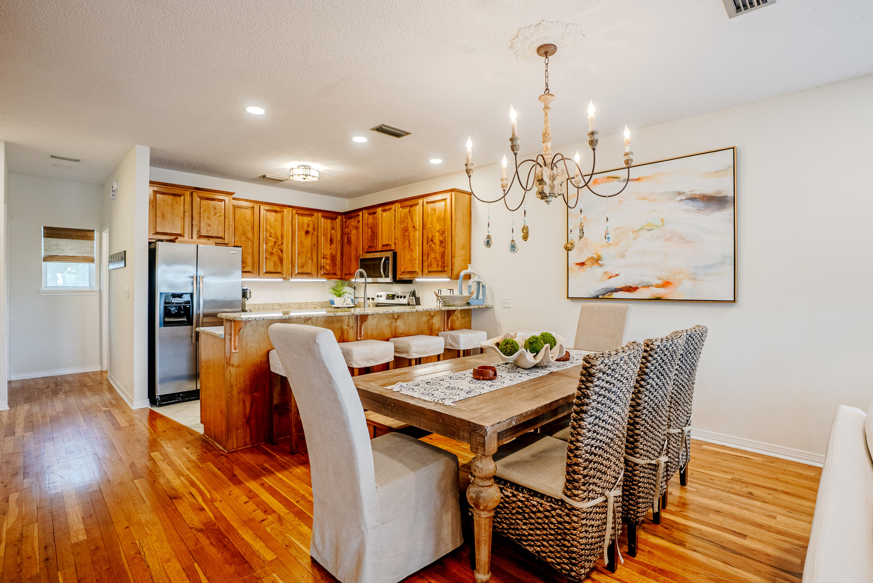 10 Mar-A-Lago Boulevard, Unit 14 Santa Rosa Beach, FL 32459 - Photo 8 of 47 a view of a dining room with furniture window and wooden floor