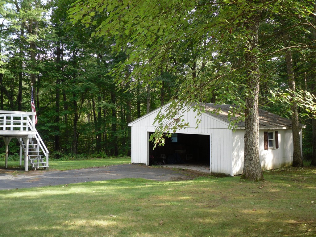 140 Squannacook Road Shirley, MA 01464 - Photo 5 of 14 a front view of a house with a yard