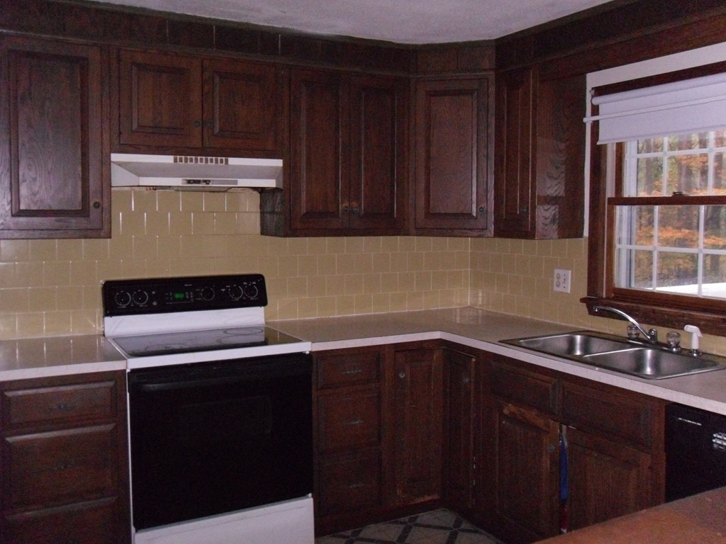 140 Squannacook Road Shirley, MA 01464 - Photo 6 of 14 a kitchen with a sink and cabinets