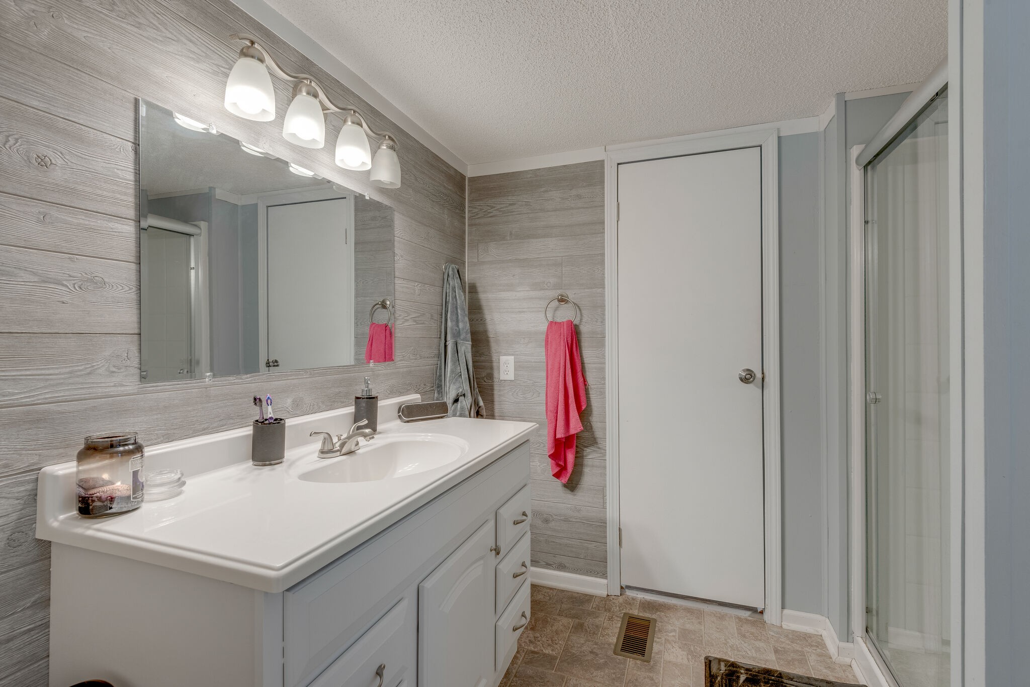 176 Duke Road Dickson, TN 37055 - Photo 18 of 26 a bathroom with a sink vanity and a mirror