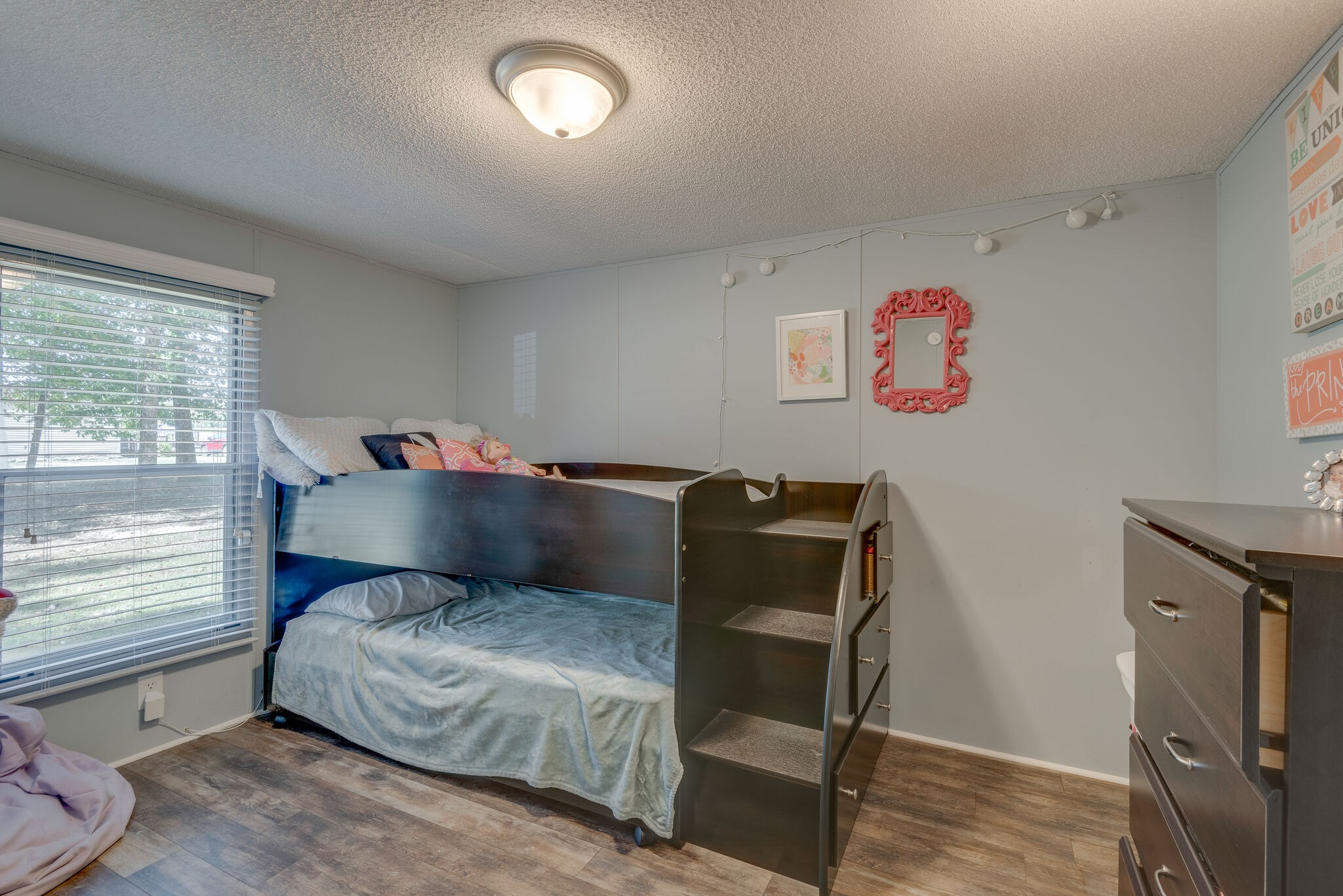 176 Duke Road Dickson, TN 37055 - Photo 21 of 26 a bedroom with a bed and wooden floor