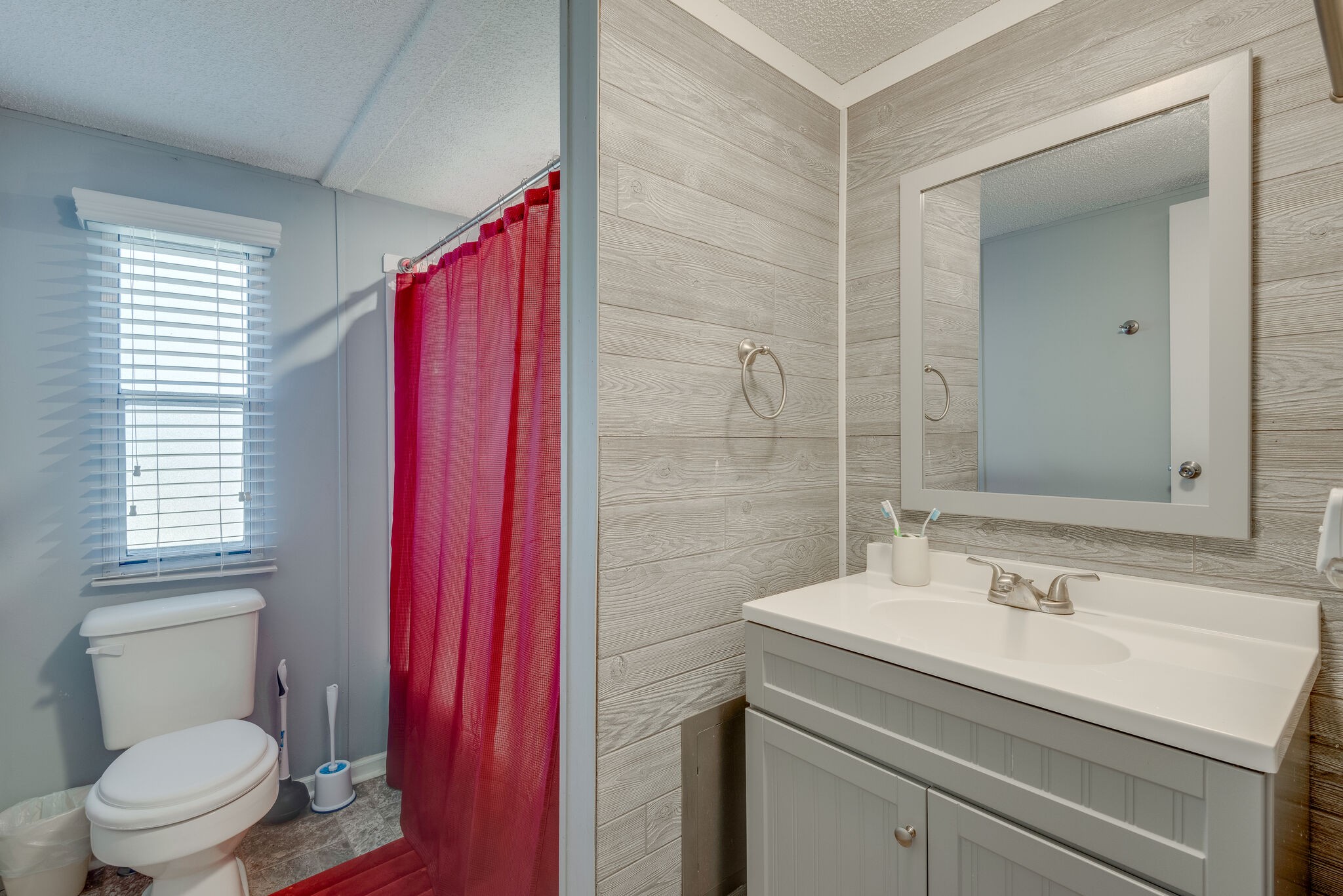 176 Duke Road Dickson, TN 37055 - Photo 23 of 26 a bathroom with a sink toilet vanity and window