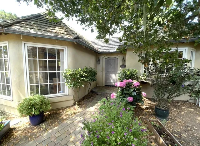 a house view with a garden space