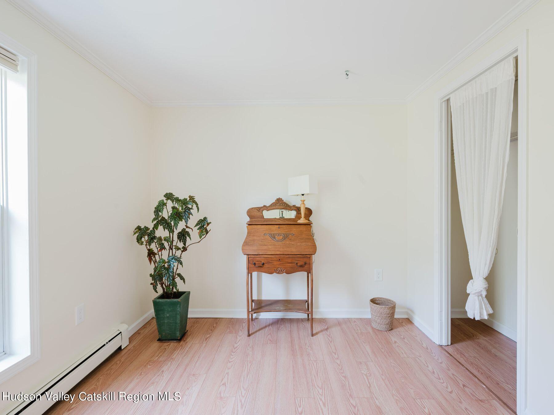 95 Patch Road Saugerties, NY 12477 - Photo 16 of 35 an empty room with wooden floor and a window