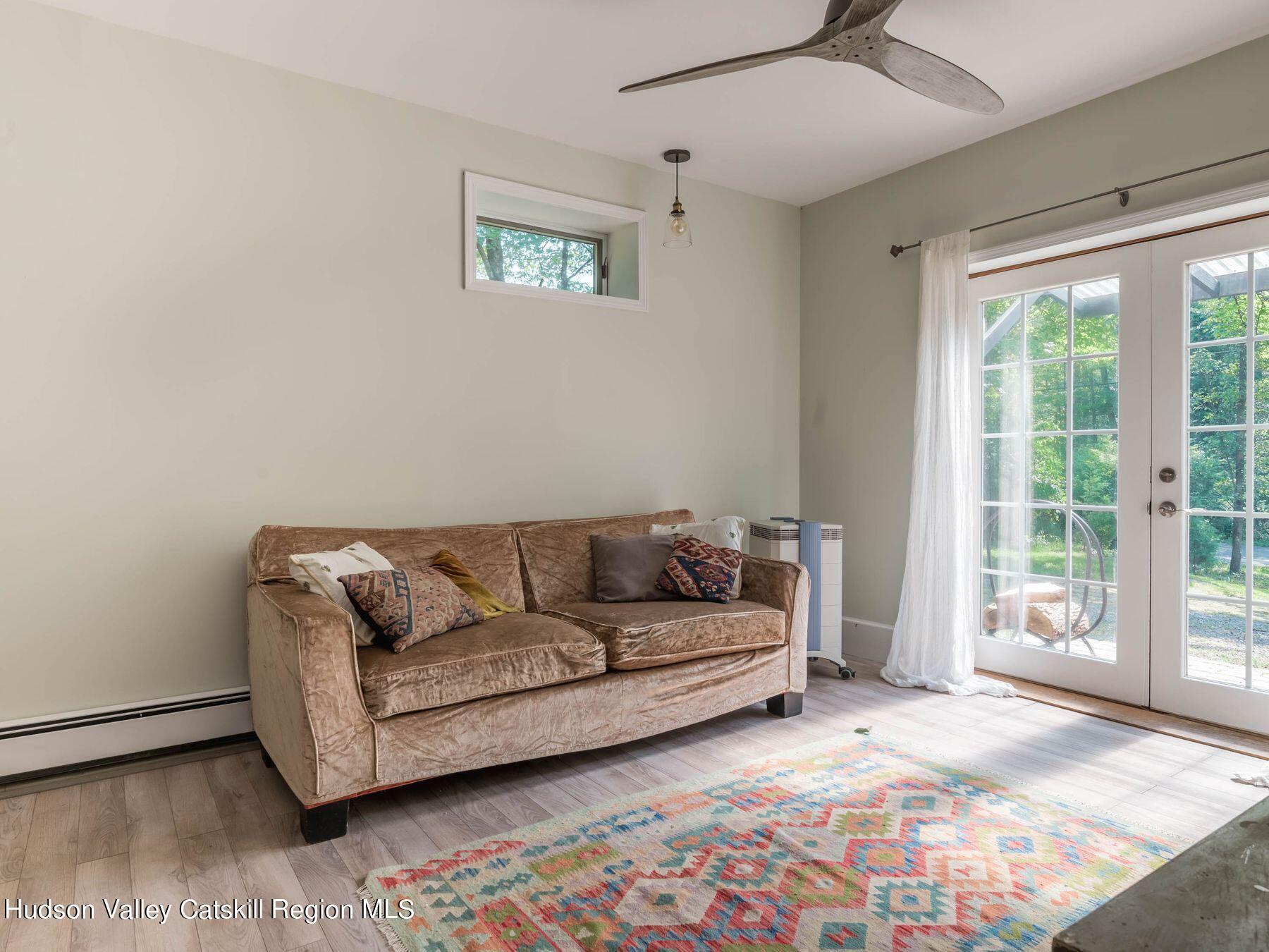 95 Patch Road Saugerties, NY 12477 - Photo 20 of 35 a living room with furniture and a rug