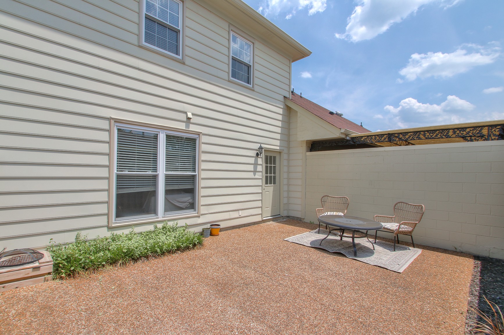 1016 General George Patton Road Nashville, TN 37221 - Photo 18 of 23 a backyard of a house with table and chairs