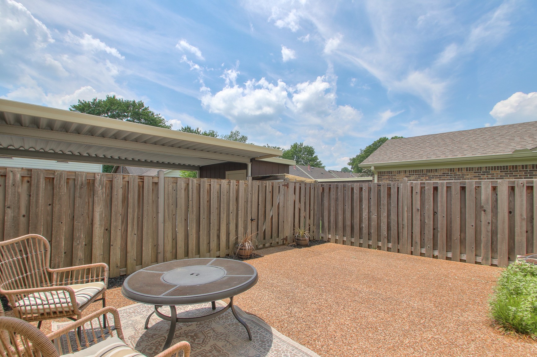 1016 General George Patton Road Nashville, TN 37221 - Photo 20 of 23 a backyard of a house with table and chairs
