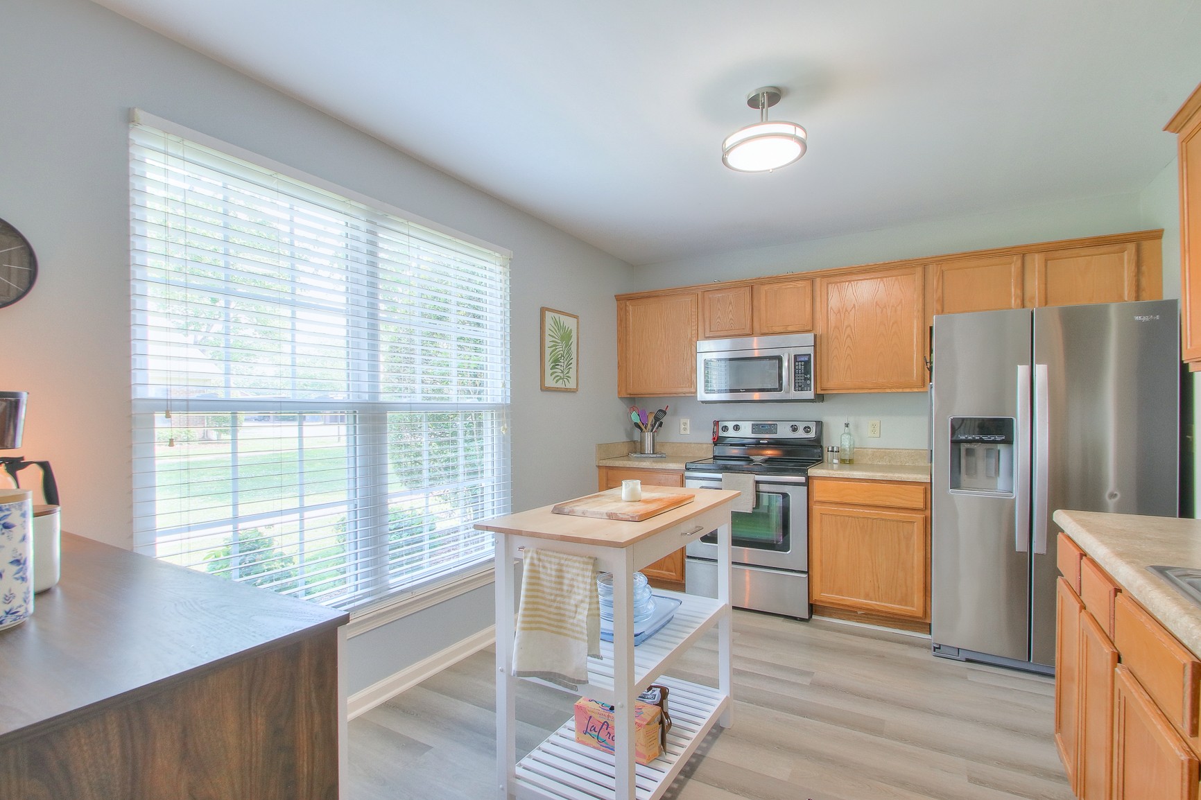 1016 General George Patton Road Nashville, TN 37221 - Photo 4 of 23 a room with stainless steel appliances granite countertop a refrigerator stove top oven and sink