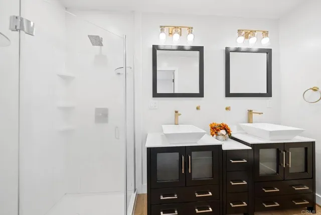 a bathroom with a sink a mirror and a vanity
