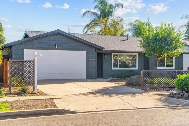 a front view of a house with a garage