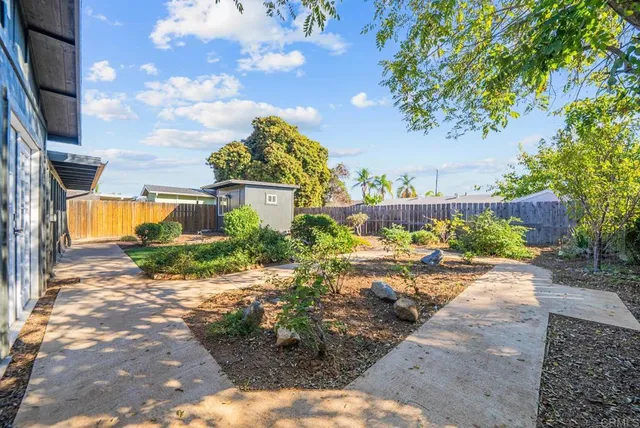 a view of a backyard of the house