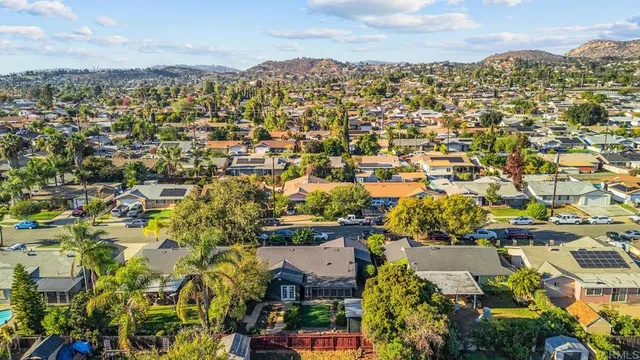 an aerial view of residential building with green space