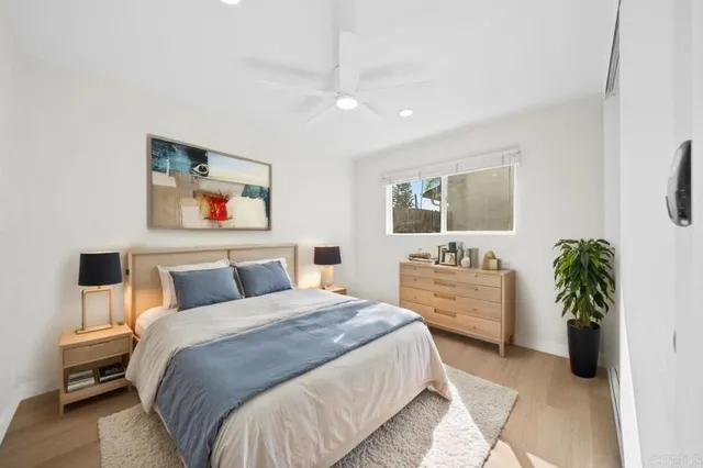 a bedroom with a large bed and a couch