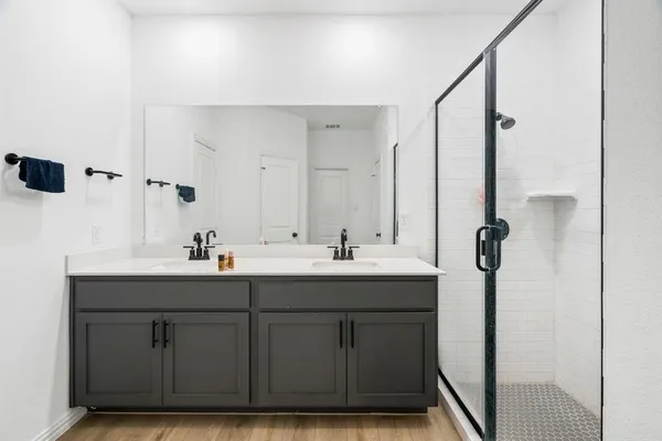 a bathroom with a sink and mirror
