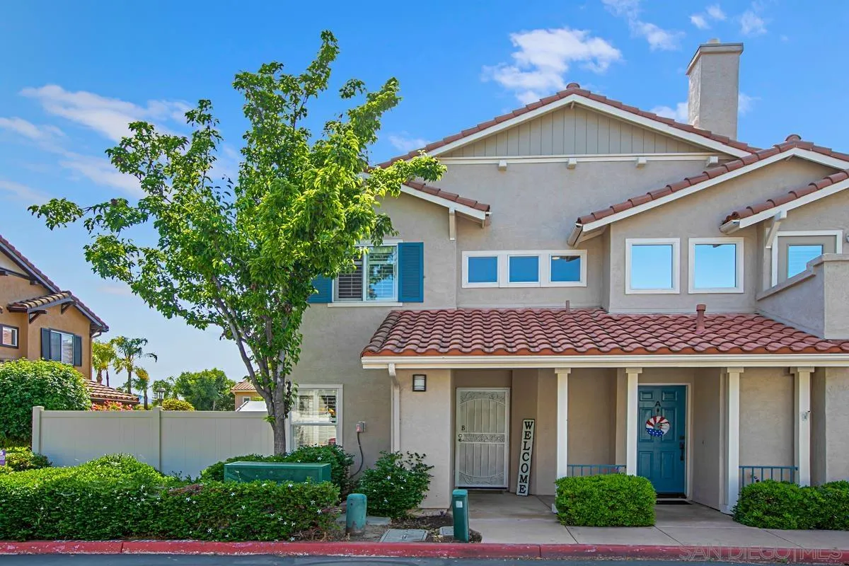 405 Whispering Willow Drive, Unit B Santee, CA 92071 - Photo 1 of 29 a front view of a house with a yard