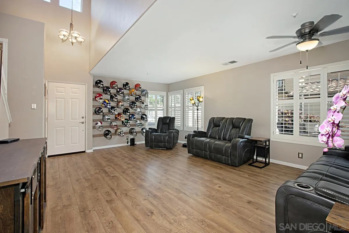 405 Whispering Willow Drive, Unit B Santee, CA 92071 - Photo 13 of 29 a living room with furniture and a fireplace