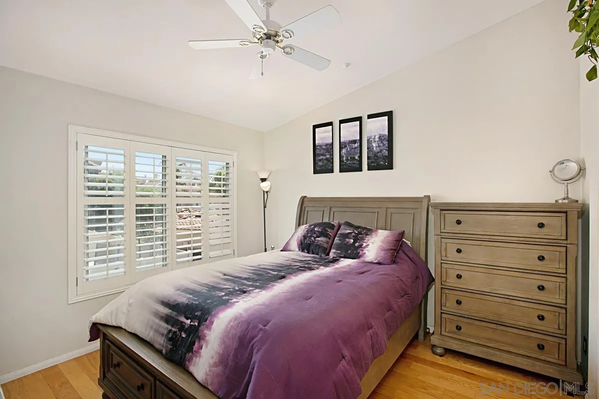 405 Whispering Willow Drive, Unit B Santee, CA 92071 - Photo 17 of 29 a bedroom with a bed and a window