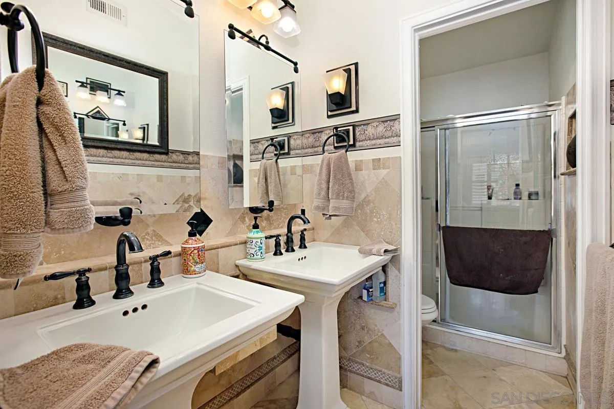 405 Whispering Willow Drive, Unit B Santee, CA 92071 - Photo 19 of 29 a spacious bathroom with a tub sink and mirror
