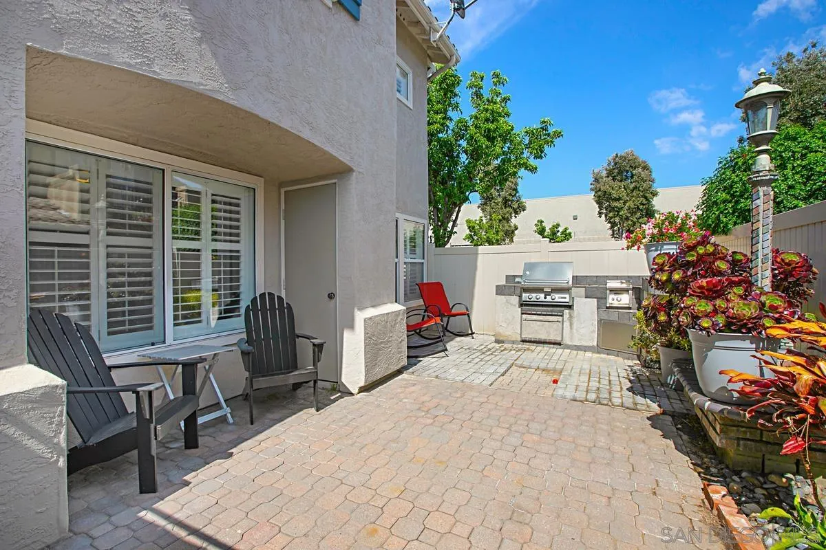 405 Whispering Willow Drive, Unit B Santee, CA 92071 - Photo 2 of 29 a balcony with furniture and a potted plant