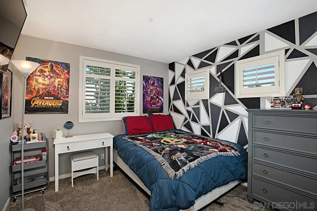 405 Whispering Willow Drive, Unit B Santee, CA 92071 - Photo 21 of 29 a bedroom with a bed and a window