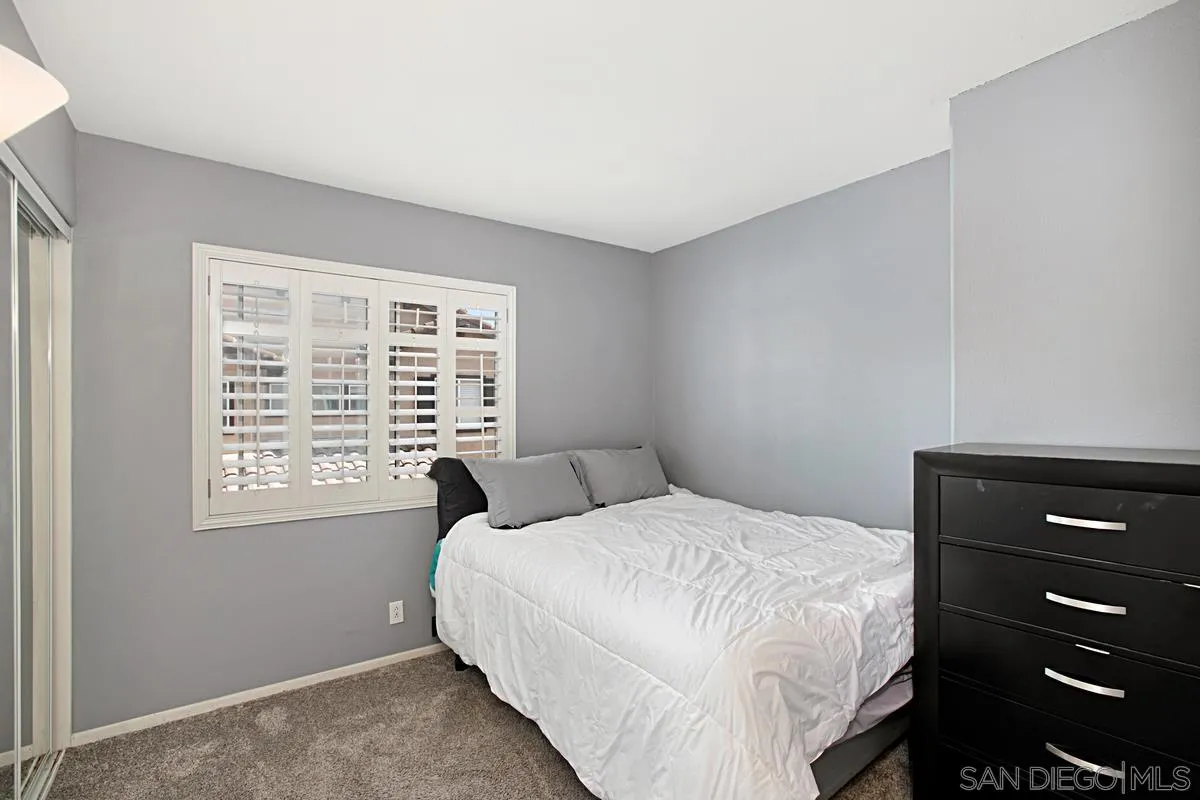 405 Whispering Willow Drive, Unit B Santee, CA 92071 - Photo 23 of 29 a bedroom with a bed and a window