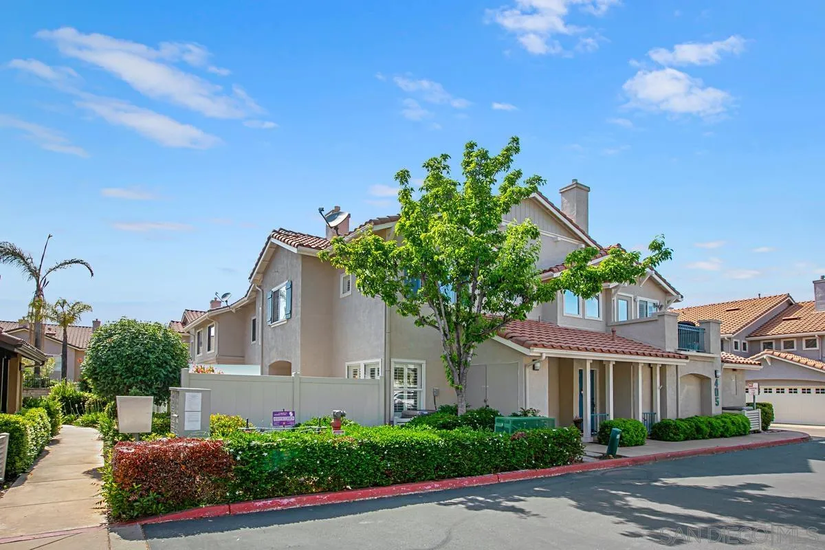 405 Whispering Willow Drive, Unit B Santee, CA 92071 - Photo 28 of 29 a front view of a house with a yard and potted plants
