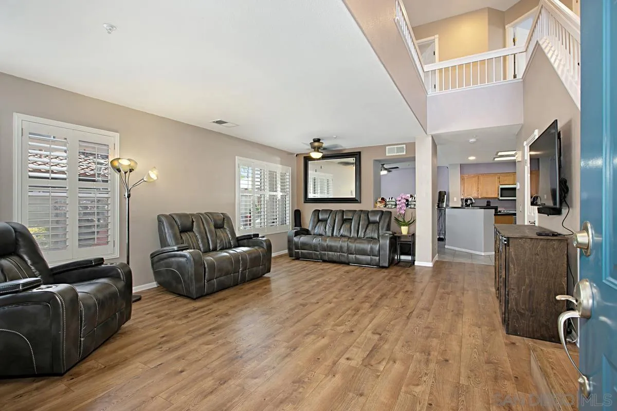 405 Whispering Willow Drive, Unit B Santee, CA 92071 - Photo 4 of 29 a living room with furniture and a flat screen tv
