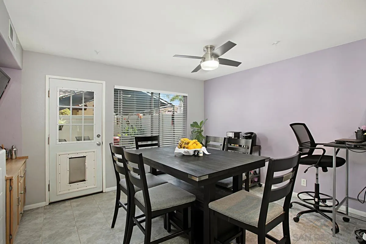 405 Whispering Willow Drive, Unit B Santee, CA 92071 - Photo 10 of 29 a view of a dining room with furniture and a chandelier