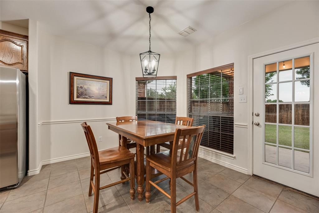 11920 Vienna Apple Road Fort Worth, TX 76244 - Photo 15 of 40 Breakfast area in kitchen with fresh paint, ceramic tile floors and views of the backyard patio at 11920 Vienna Apple in Villages of Woodland Springs community in North Fort Worth