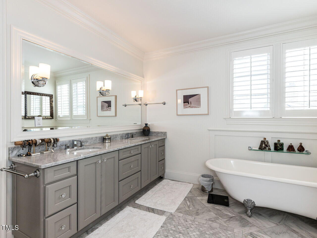 543 Guilford Circle Raleigh, NC 27608 - Photo 13 of 46 a bathroom with double vanity sinks a mirror and a bathtub