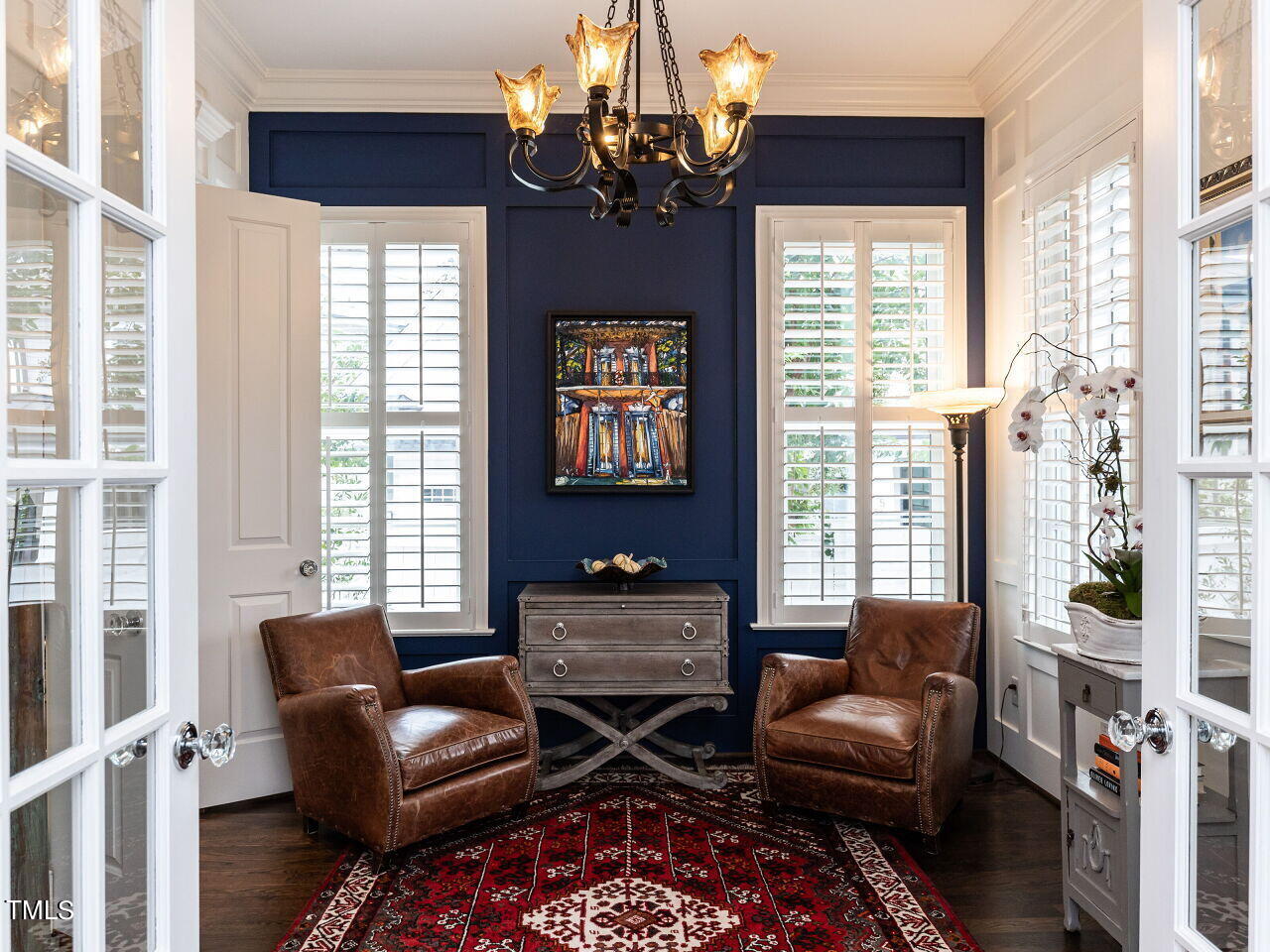 543 Guilford Circle Raleigh, NC 27608 - Photo 14 of 46 a living room with furniture windows and a chandelier