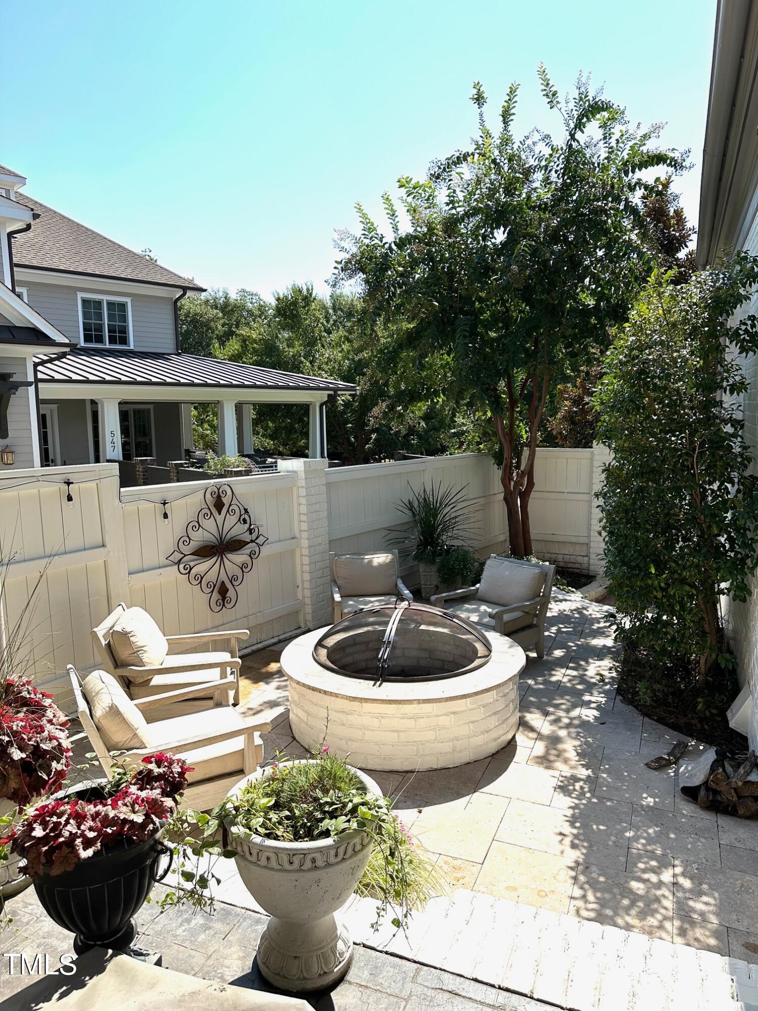 543 Guilford Circle Raleigh, NC 27608 - Photo 18 of 46 a view of a backyard with furniture and plants