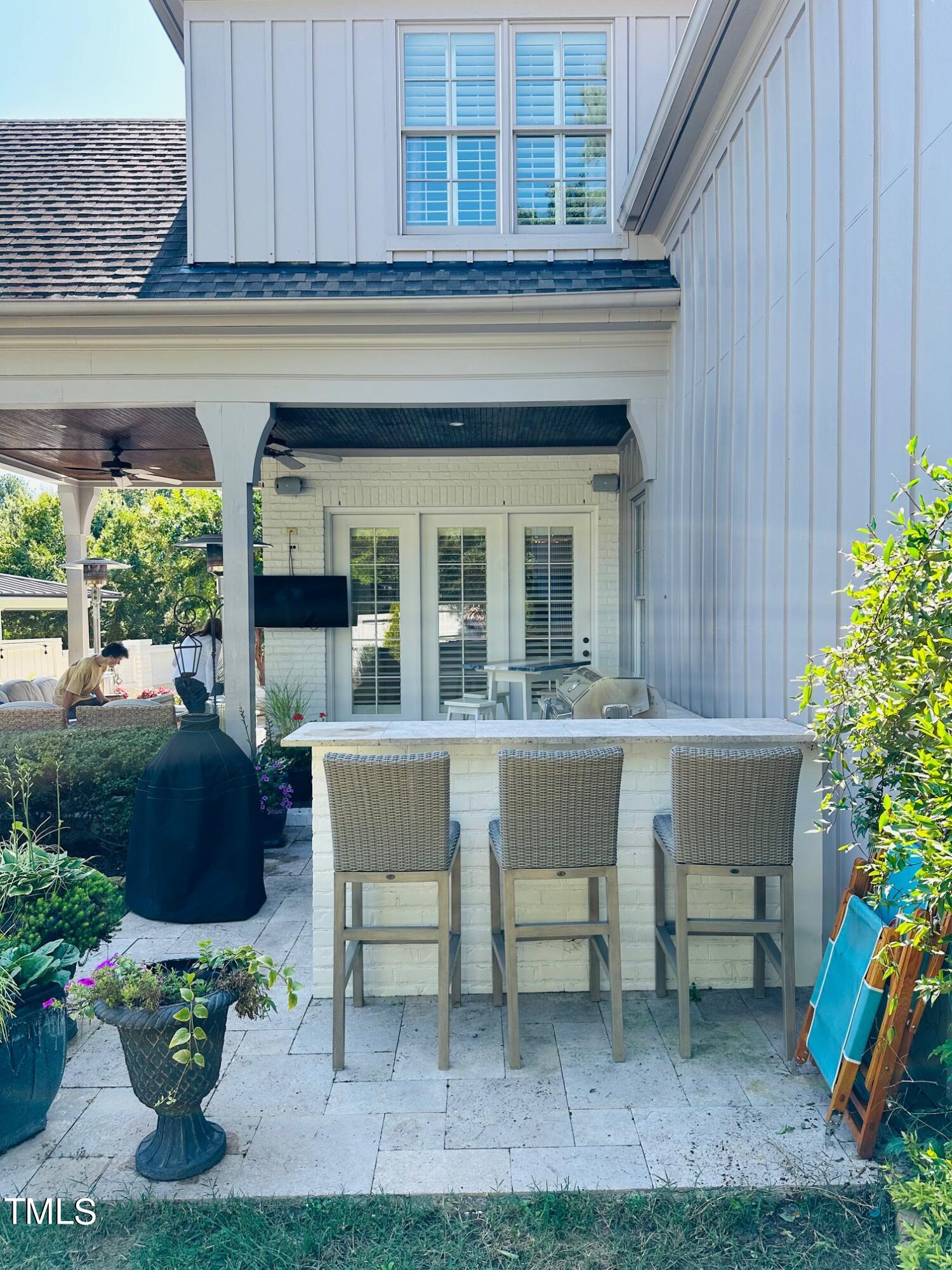 543 Guilford Circle Raleigh, NC 27608 - Photo 20 of 46 a view of a chair and tables in the back yard of the house