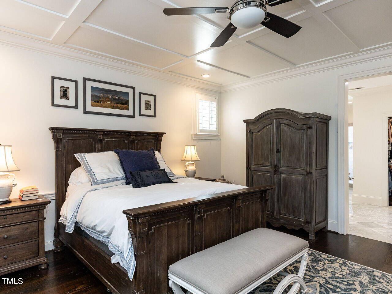 543 Guilford Circle Raleigh, NC 27608 - Photo 30 of 46 a bedroom with a bed and wooden floor