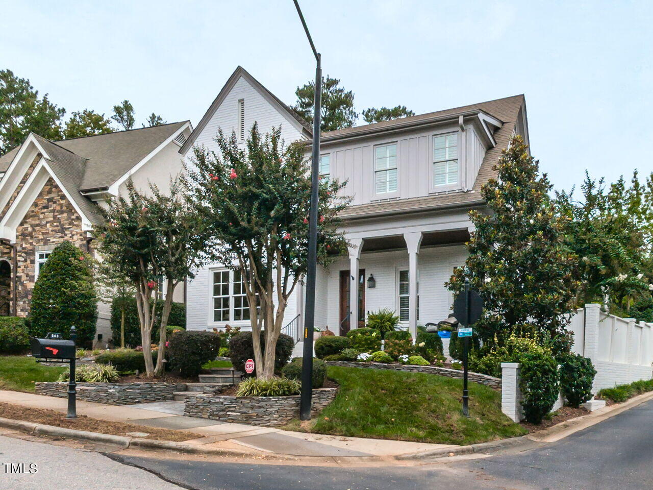 543 Guilford Circle Raleigh, NC 27608 - Photo 33 of 46 a front view of a house with garden and plants