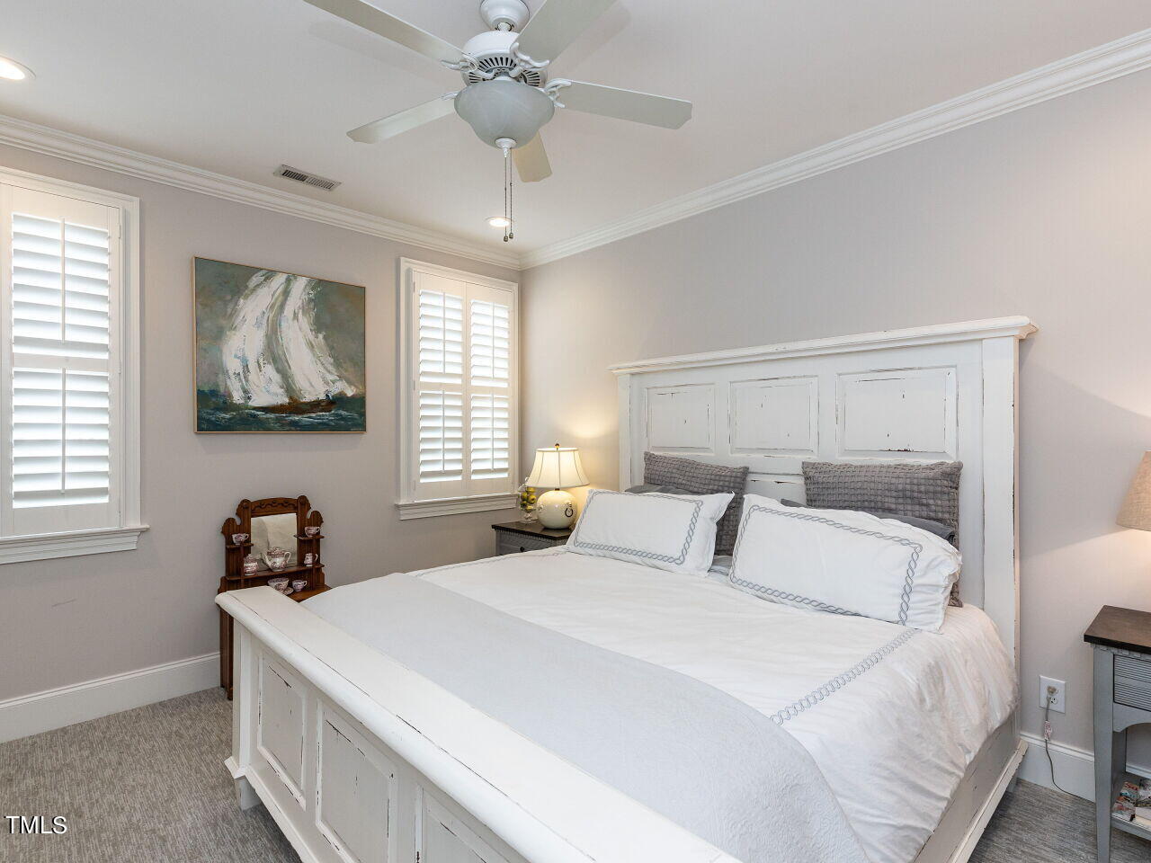 543 Guilford Circle Raleigh, NC 27608 - Photo 35 of 46 a bedroom with a large bed and a window