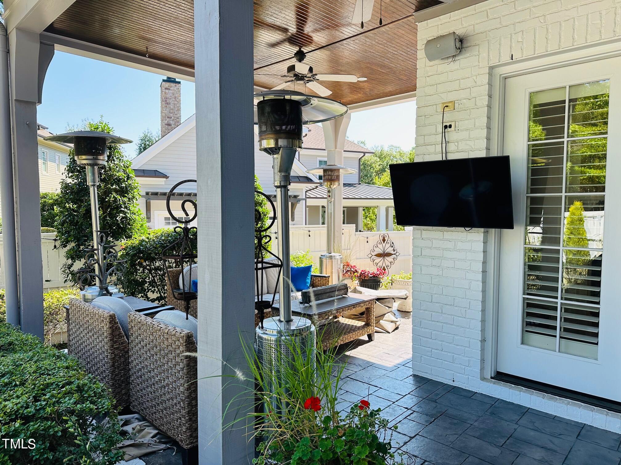 543 Guilford Circle Raleigh, NC 27608 - Photo 37 of 46 a view of a porch with chairs and potted plants