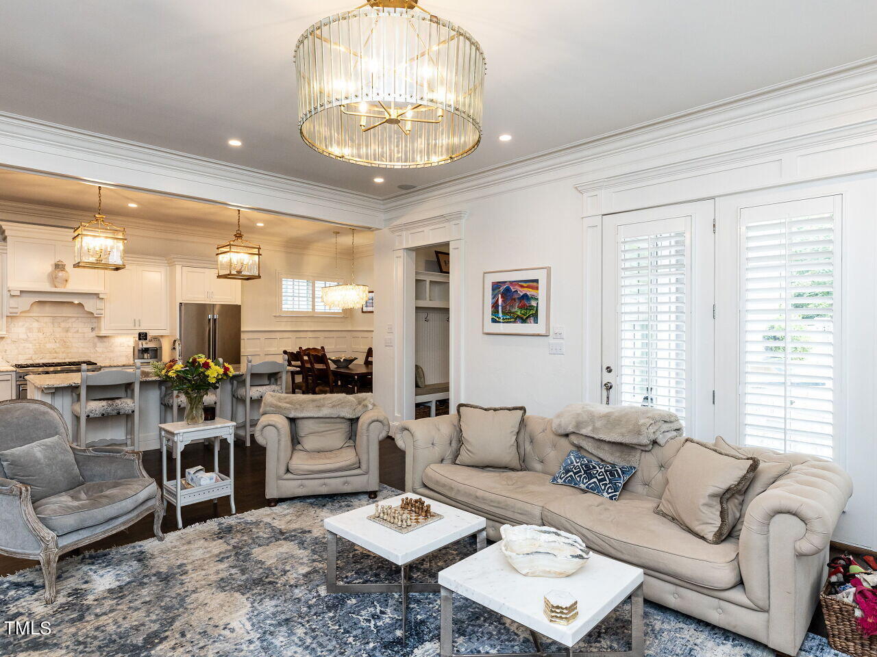543 Guilford Circle Raleigh, NC 27608 - Photo 7 of 46 a living room with furniture wooden floor and kitchen view