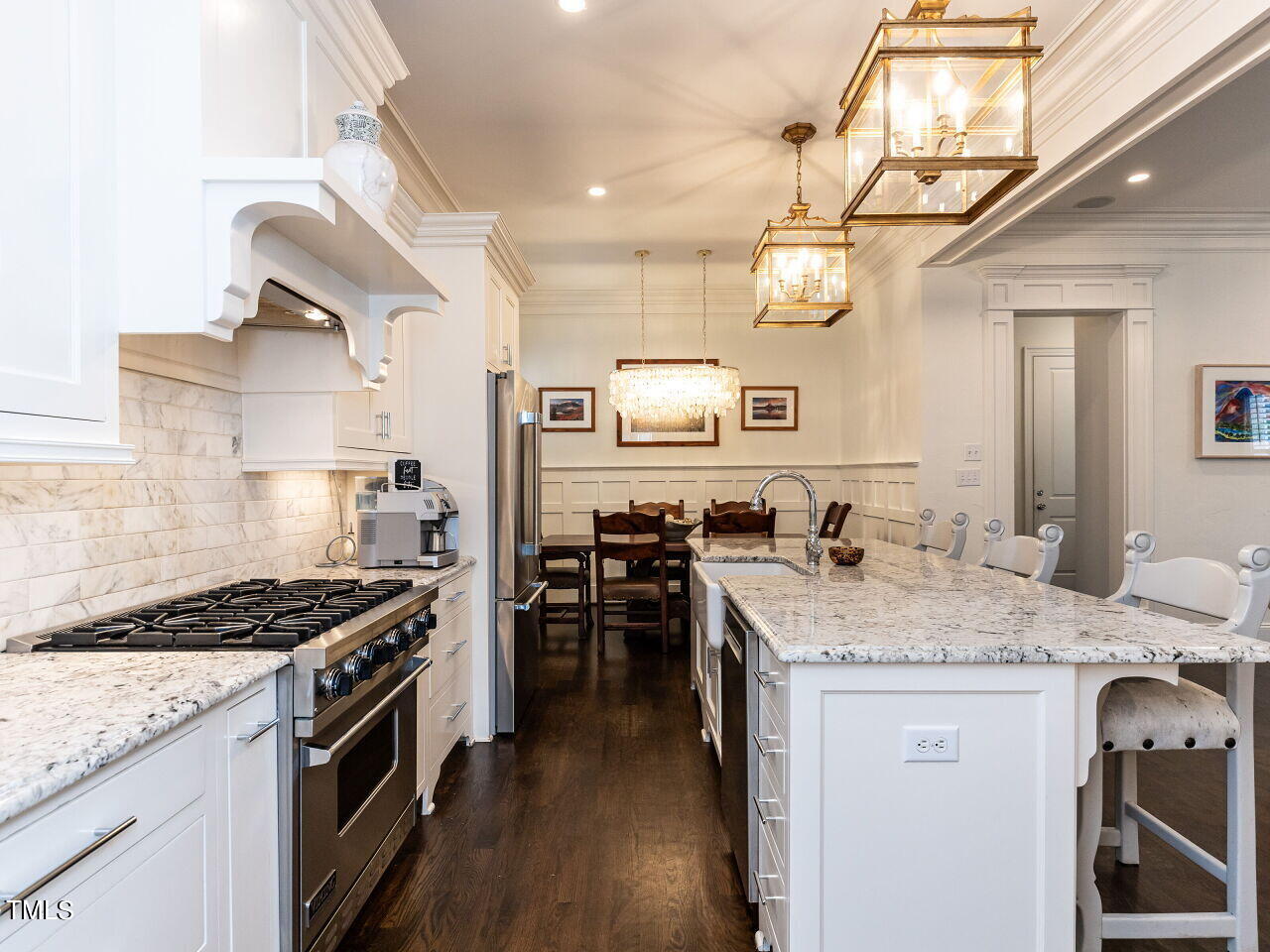543 Guilford Circle Raleigh, NC 27608 - Photo 10 of 46 a kitchen with granite countertop a sink stove and cabinets
