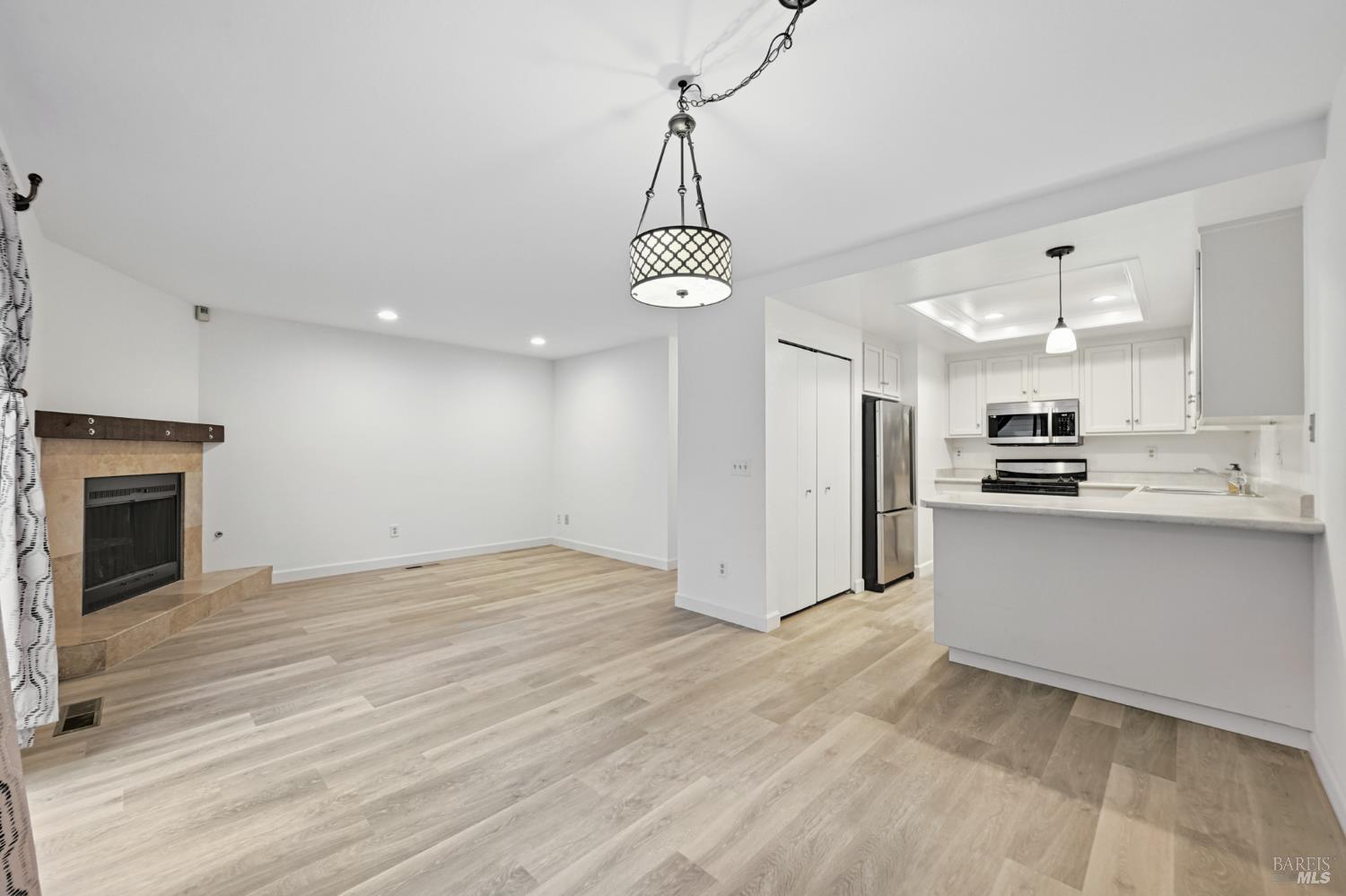 1240 North Street Santa Rosa, CA 95404 - Photo 18 of 36 a view of a kitchen with refrigerator and cabinets