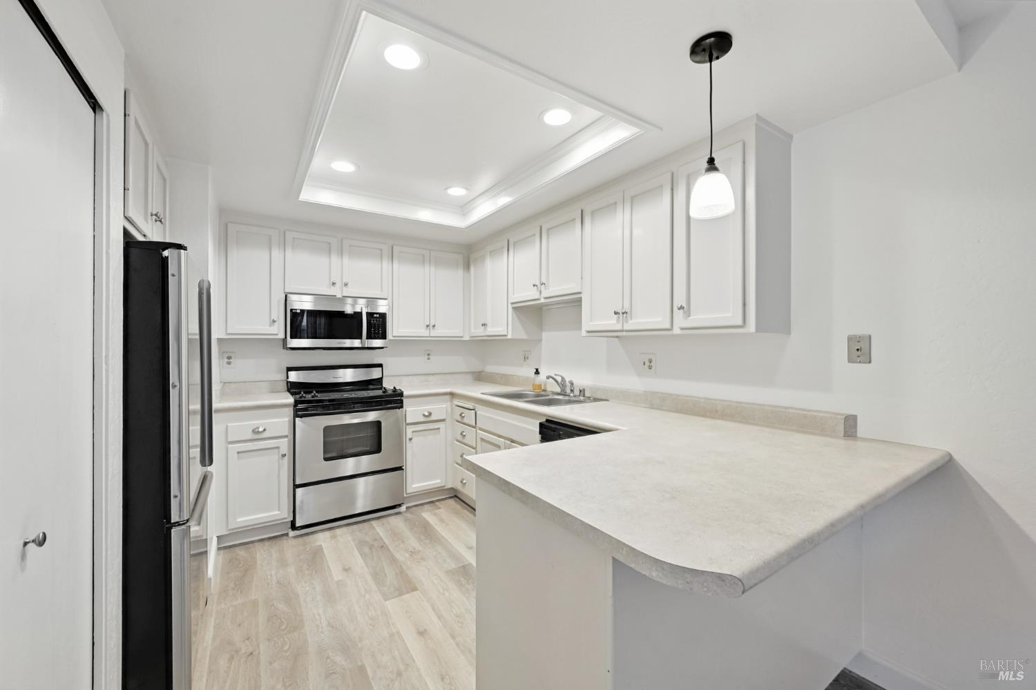 1240 North Street Santa Rosa, CA 95404 - Photo 20 of 36 a kitchen with a stove a sink and a refrigerator