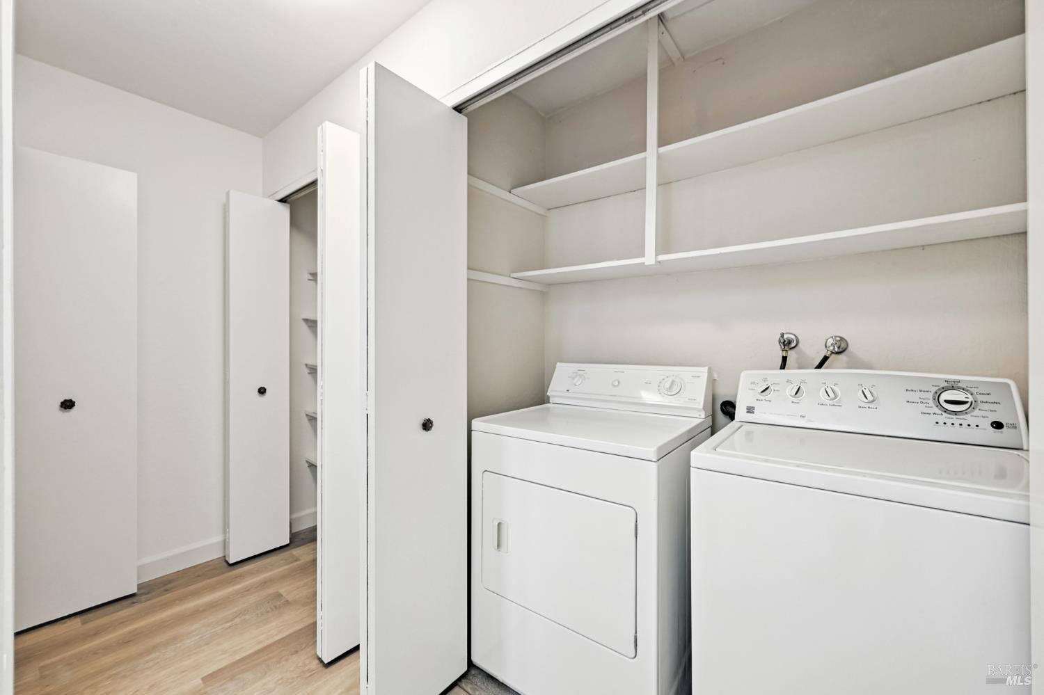 1240 North Street Santa Rosa, CA 95404 - Photo 24 of 36 a view of storage and utility room with washer and dryer