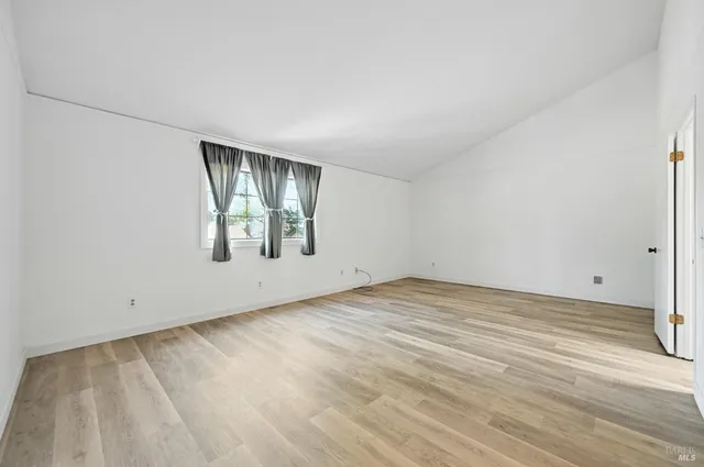 an empty room with windows