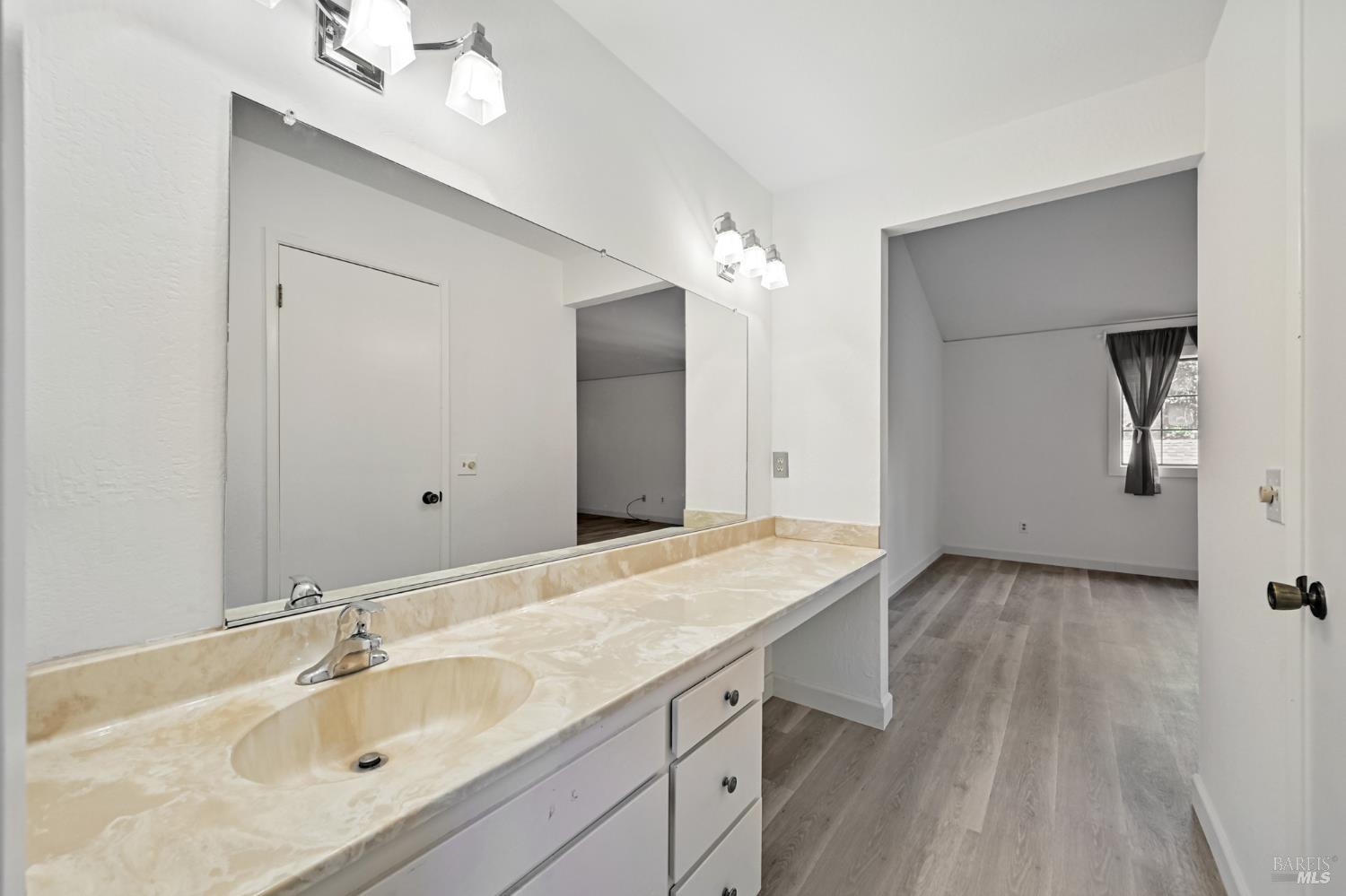 1240 North Street Santa Rosa, CA 95404 - Photo 32 of 36 a bathroom with a sink and a mirror