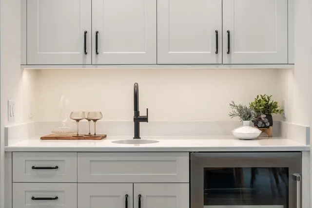 a kitchen with a sink and cabinets
