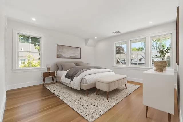 a bedroom with bed and a window