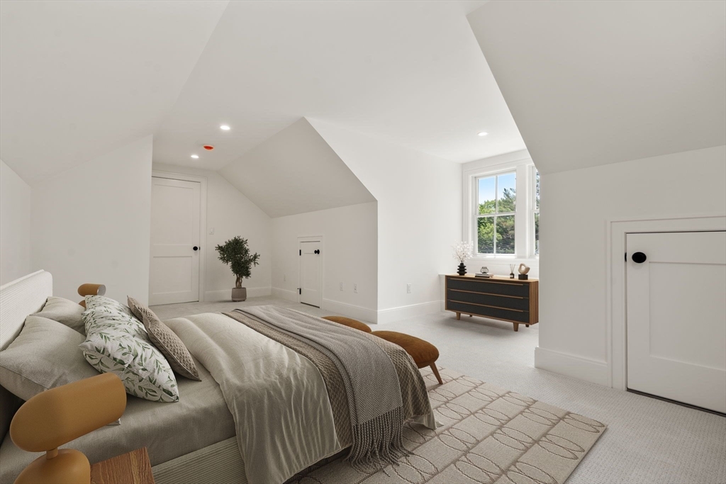 233 Warren Street Needham, MA 02492 - Photo 23 of 32 a bedroom with a bed and a couch