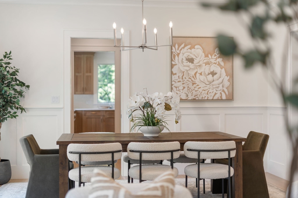 233 Warren Street Needham, MA 02492 - Photo 5 of 32 a view of a dining room with furniture window and wooden floor